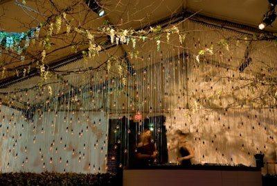 Bloomberg L.P.'s White House Correspondents Association dinner after-party featured a curtain by Design Cuisine of more than 700 custom lightbulbs, each with a filament in the shape of a Bloomberg terminal.