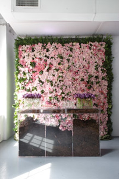 Instead of the usual floral centerpieces, Van Wyck & Van Wyck created a fragrant wall of roses for the launch of Bulgari's women's perfume Omnia Amethyste in New York.
