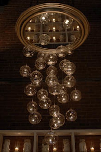 At Diffa's Dining by Design benefit in New York, student designers from the Academy of Art suspended glass globes from a mirror that showed reflections of the entire dining environment.