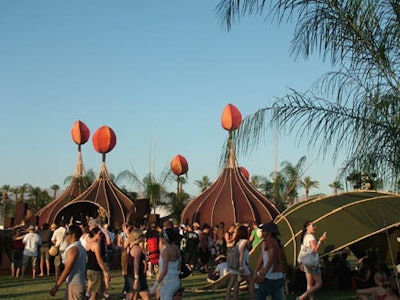 Whimsical, fabric-covered rattan pods by Do Lab at this year's Coachella Valley Music and Arts Festival provided shady gathering places for concertgoers.