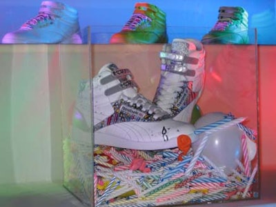 To celebrate the 25th anniversary of Reebok's Freestyle shoe, the shoemaker's New York bash, designed and produced by Strategic Group, featured vignettes of the '80s footwear planted in a bed of birthday candles.