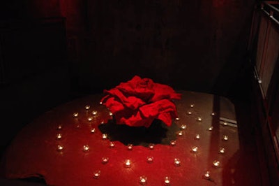 Two large paper roses surrounded by tea lights flanked the walkway entering the room.