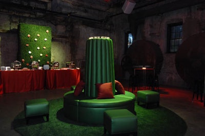 Ottomans placed atop large Astroturf carpets provided a grassy setting for guests to lounge.