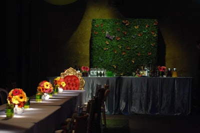 Paper butterflies decorated the boxwood hedges behind the bars.