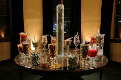 A tall vase filled with shredded cash made for a conversation-starting centerpiece on the candy buffet table.