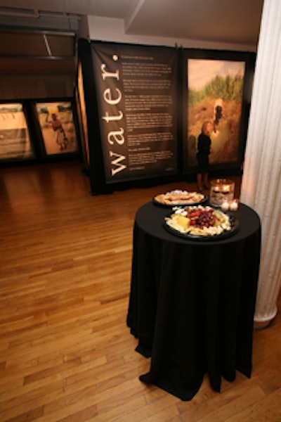 In addition to being passed, hors d'oeuvres were placed on highboys draped in black linens.