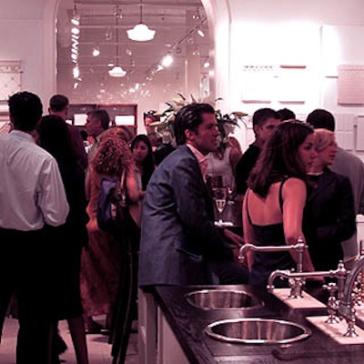 A crowd of designers and magazine editors mingled in the Waterworks store among shining bath tiles, gleaming bathroom sinks and gorgeous bathtubs.