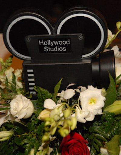 One of three Hollywood-inspired centerpieces designed by Designs by Sean adorned each table.