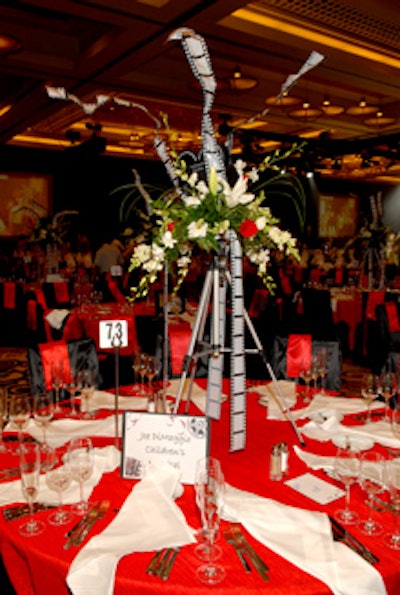 In keeping with the movie production theme, Designs by Sean also created this centerpiece using tripods.