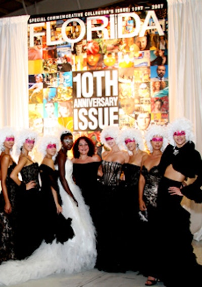 Yoly Munoz posed with models clad in her designs in front of a blown-up image of the magazine cover.