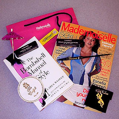 The party's gift bag included items a bombshell's purse would contain, including two M.A.C. Lipsticks, gum, a cocktail umbrella and coasters and a pen from the Carlyle.