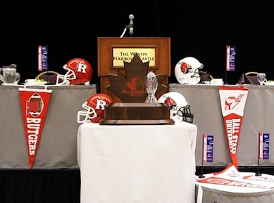 Football helmets and team pennants dressed the head table and surrounded the International Bowl trophy at Friday's lunch.