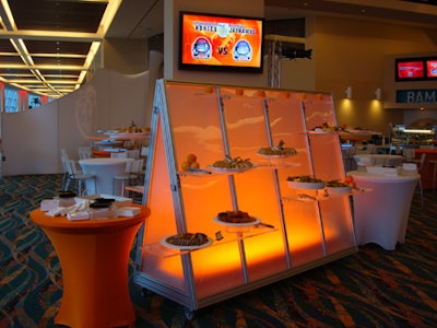 Occasions Caterers provided custom-made Lucite vertical buffet tables, which went along with the futuristic theme.