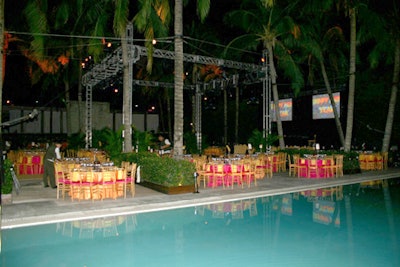 At the poolside Lagoon Dinner Dance, sunset-colored linens covered the tables surrounding the event stage and dance floor provided by EventStar.