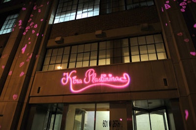 To draw attention to the event and brand the building, the production team washed the facade with pink hearts and the collection's logo.
