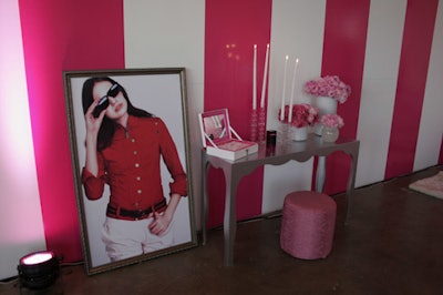 In the bedroom area, wide vertical pink and white stripes decorated the walls.