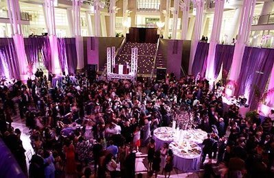 The event turned the Reagan Building's cavernous space into a purple-bathed nightclub.