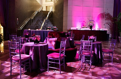 Clusters of chairs and velvet banquettes swathed in purple hues dotted the main space.
