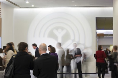 A projection of the United Way logo decked a wall in the reception area.