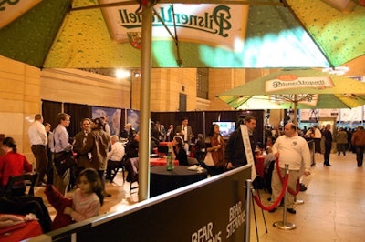 Under umbrellas from Pilsner Urquell, tables, chairs, and TVs filled the Bear Stearns patrons lounge on the west side of Vanderbilt Hall.