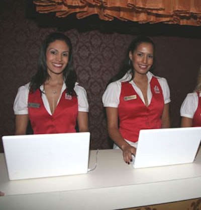 Local greeters outfitted as concierges depicted a hotel's front desk by checking in guests one by one as they arrived.