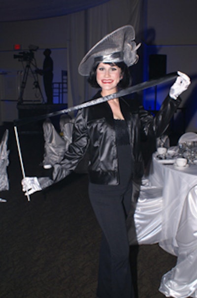 Entertainers and models in monochromatic costumes-to evoke a world lacking creativity and opportunity-greeted guests as they entered.