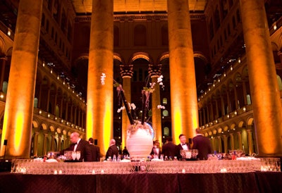 The focal point of the reception was a hollow square bar featuring an enormous centerpiece of white orchid, moss, and black bamboo from Randy Watts Design.