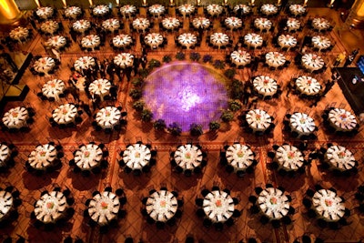 Black-and-white tables circled the space's center fountain.