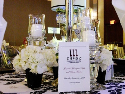 Small vases of white hydrangeas and crystal candleholders surrounded the centrepieces.