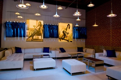 The V.I.P. lounge was an elevated platform decorated in Old Navy's signature colors of blue and white. An artistic installation of jeans hung by the wall.
