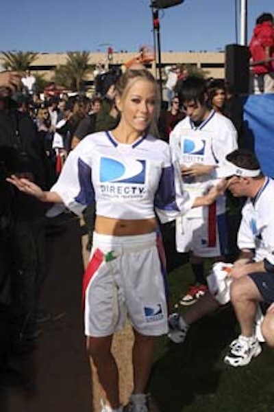 The players, including Kendra Wilkinson, sported blue and white game shirts with 'DirecTV' emblazoned on them.