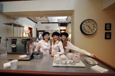 At the counter in the front, servers in berets pour coffee into mugs or takeaway cups.