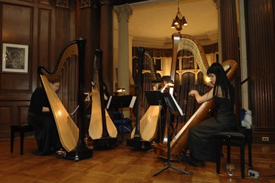 A quartet of harpists performed in the library of the Casa Loma.