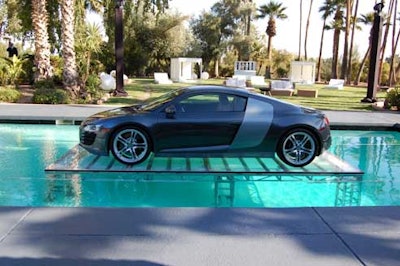 Worth $120,000, the 2008 Audi R8 sits atop a plexiglass truss in the pool.
