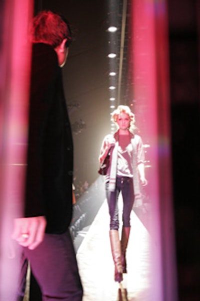 Even from backstage, the lights at the entrance of the runway shone brightly.