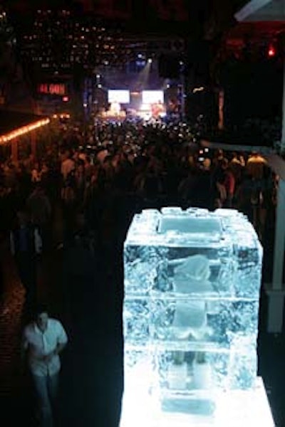 A model stood encased in ice at Vice the Party while LL Cool J performed on stage.