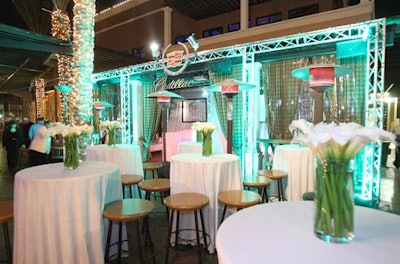 White highboys and sleek trumpet-lily centerpieces decorated the Cadillac lounge at Club SI.