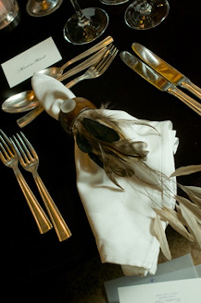 Michael McKinnon added feather trim on napkin rings (and also atop the backs of chairs).