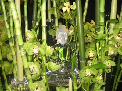 Towering stalks of bamboo dominated the Bernhard Blythe table for Baccarat, which included a nestled crystal Buddha statue.