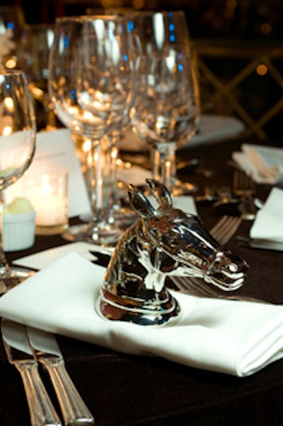 For the Safavieh setting, Thom Felicia weighed down napkins with horse-head statuettes instead of rings.