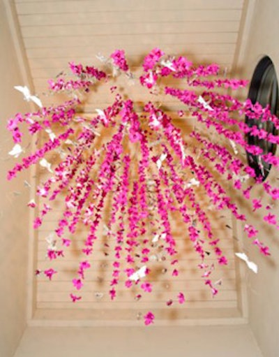 The evening's centerpiece was a large chandelier made with pink orchids.