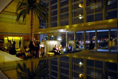 The glass wall of the atrium drew guests onto the balcony to experience the expansive view of Biscayne Bay.