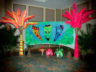 Galaxy Productions created unique airbrushed decor elements that were positioned in the corners of the ballroom to serve as backdrops for event snapshots.