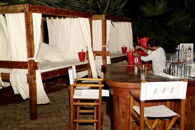 Private white-draped cabanas lined the outdoor patio.