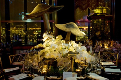 The Lars Bolander dining table blended larger-than-life mushroom sculptures with white orchids.