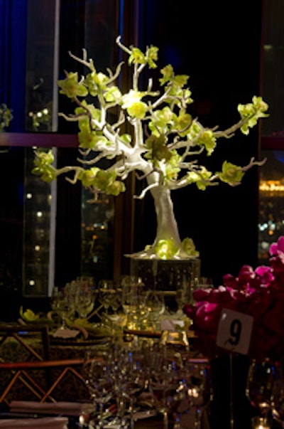 Timothy Whealon Interiors created a stark tree centerpiece budding with orchids that stood in for leaves. Around its base was a small pool of water with live goldfish.