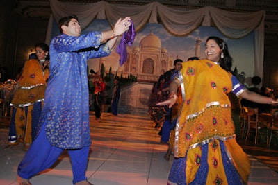 Dancers performed in the central space, in front of a Taj Mahal mural.
