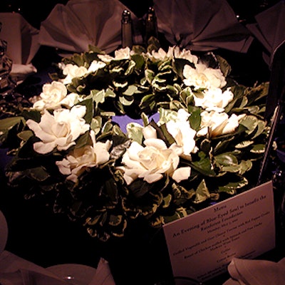 Zeze Flowers brought in pittosporum and gardenia centerpieces, which were accented by small crystal table lamps.