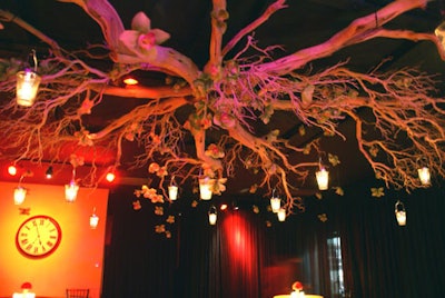 Guests were awed by the ceiling installation Botanica created using large manzanita-like branches with floating votive candles.