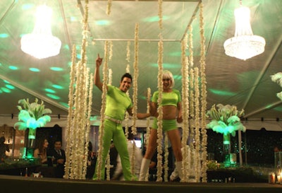 Models donning lime-green costumes danced to techno beats provided by Music on the Move.